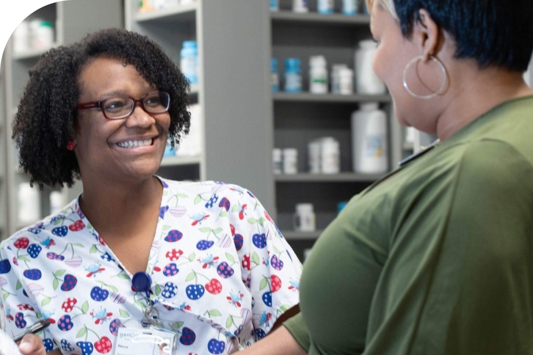 Genoa pharmacy team member talking with a customer at the mental health clinic.